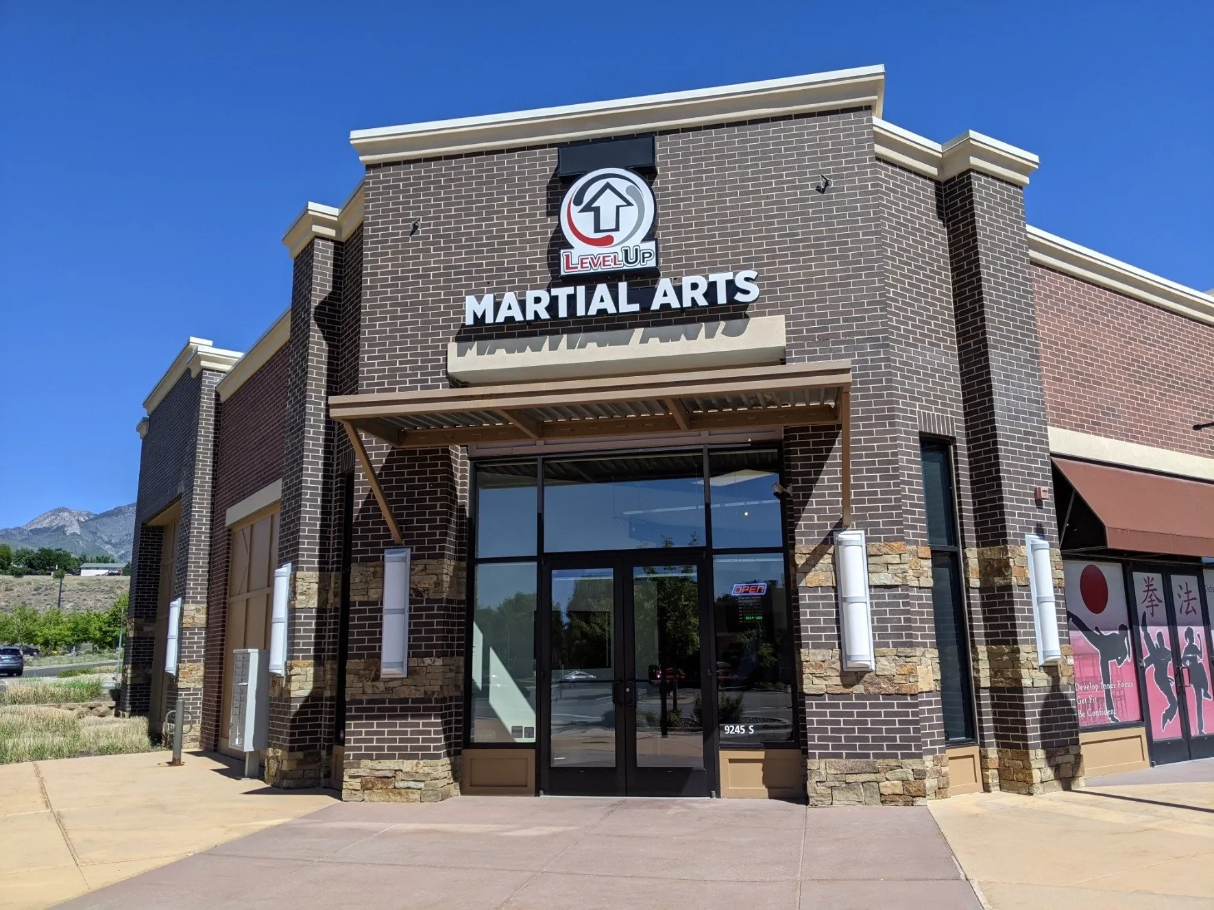 Martial arts academy storefront on sunny day